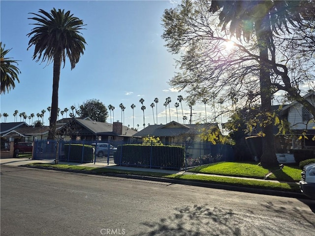 4911 S Wilton Pl, Los Angeles, CA 90062 - view of front facade featuring a gate and a residential view