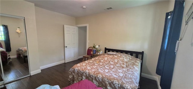 4911 S Wilton Pl, Los Angeles, CA 90062 - bedroom with wood finished floors and baseboards