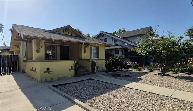 4911 S Wilton Pl, Los Angeles, CA 90062 - bungalow-style house with roof with shingles and stucco siding