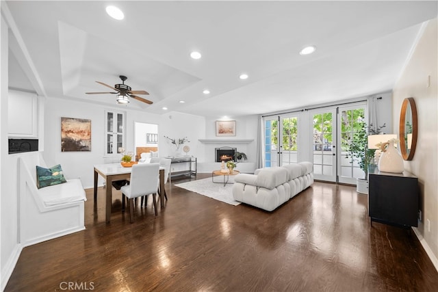 1930 S Beverly Glen Blvd Unit 103, Los Angeles, CA 90025 - living area featuring a warm lit fireplace, recessed lighting, wood finished floors, a ceiling fan, and baseboards