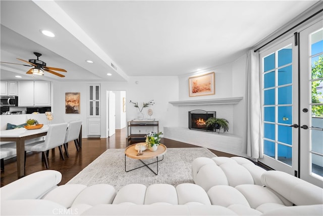 1930 S Beverly Glen Blvd Unit 103, Los Angeles, CA 90025 - living area with recessed lighting, dark wood finished floors, a fireplace, and a ceiling fan