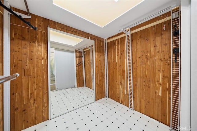 1930 S Beverly Glen Blvd Unit 103, Los Angeles, CA 90025 - corridor with tile patterned floors and wooden walls
