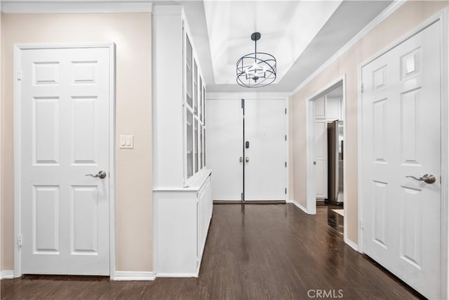 1930 S Beverly Glen Blvd Unit 103, Los Angeles, CA 90025 - foyer entrance featuring a chandelier, dark wood-type flooring, baseboards, a tray ceiling, and crown molding