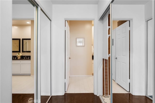 1930 S Beverly Glen Blvd Unit 103, Los Angeles, CA 90025 - hallway featuring tile patterned floors and baseboards