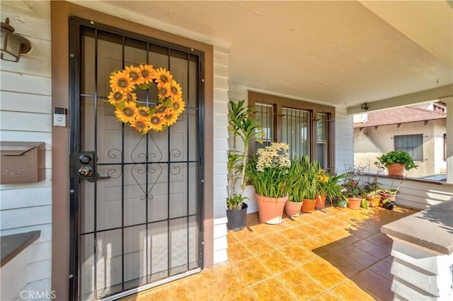 doorway to property with a porch