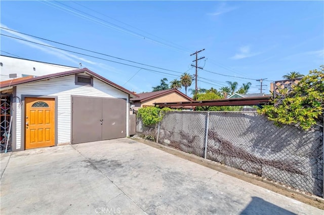 garage with fence