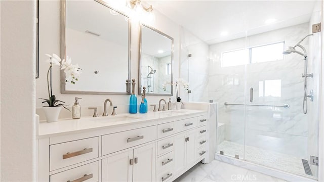bathroom featuring double vanity, a sink, a marble finish shower, and marble finish floor