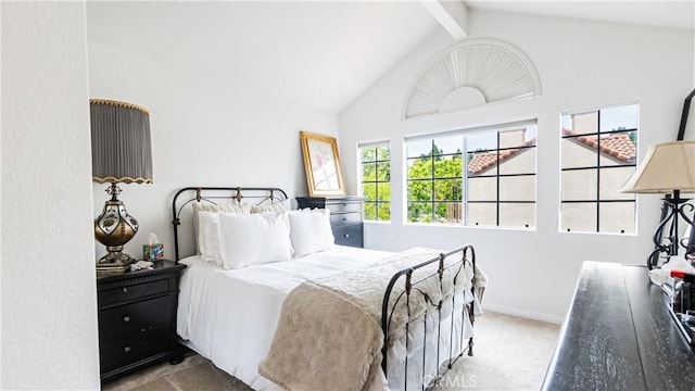 carpeted bedroom featuring baseboards, high vaulted ceiling, and beamed ceiling