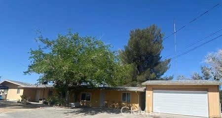 8782 Peach Ave, Hesperia, CA 92345 - single story home featuring an attached garage, driveway, and stucco siding
