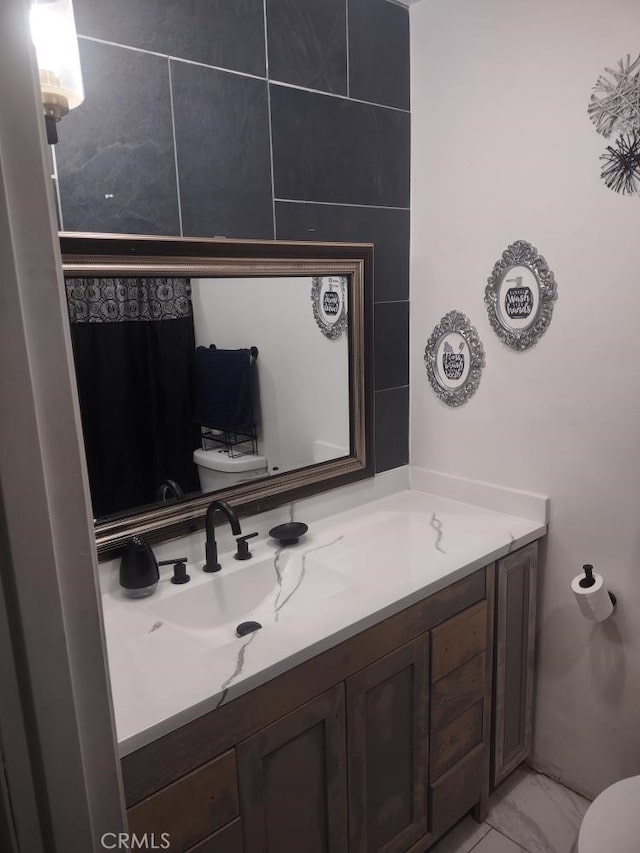 8782 Peach Ave, Hesperia, CA 92345 - bathroom with vanity, marble look tiles, and a shower with curtain