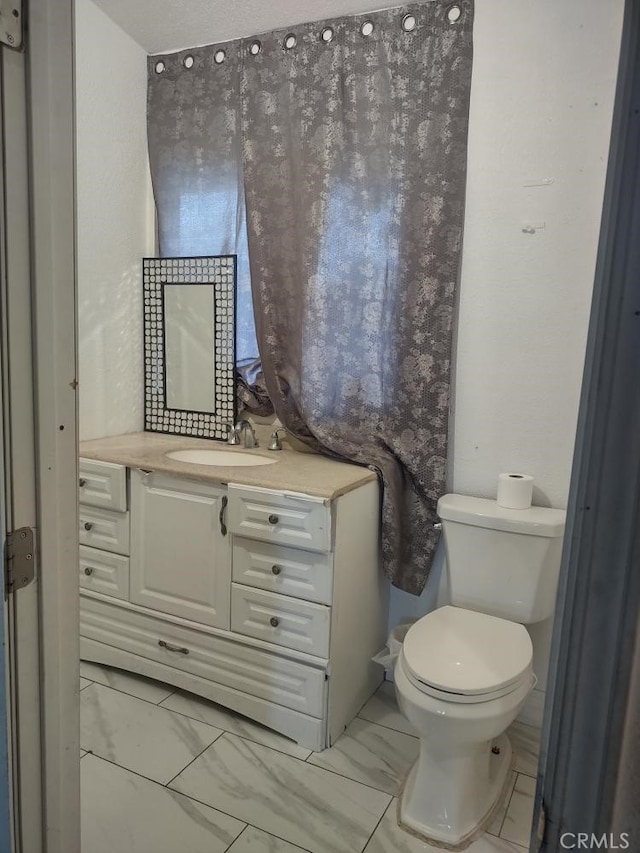 8782 Peach Ave, Hesperia, CA 92345 - bathroom with vanity and marble look tile flooring