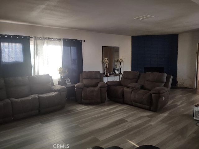 8782 Peach Ave, Hesperia, CA 92345 - living area with wood finished floors and a large fireplace