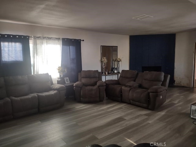 8782 Peach Ave, Hesperia, CA 92345 - living room with wood finished floors and a large fireplace