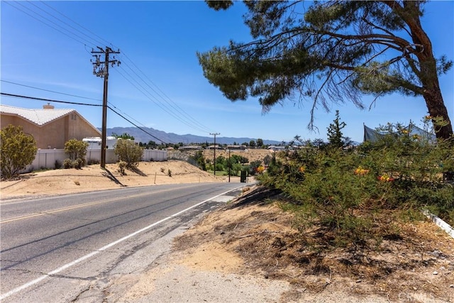 8782 Peach Ave, Hesperia, CA 92345 - view of asphalt road featuring a mountain view