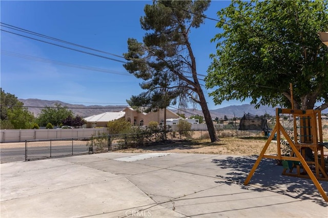 8782 Peach Ave, Hesperia, CA 92345 - view of patio with a playground and a mountain view