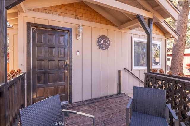property entrance with a deck