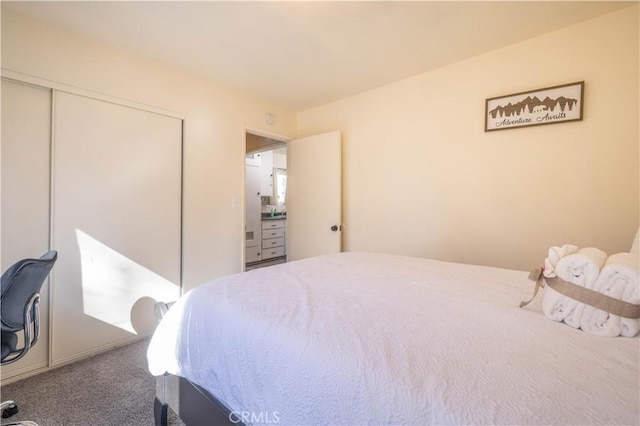 bedroom with carpet and a closet
