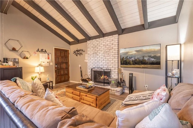 living room with wooden ceiling, wood finished floors, vaulted ceiling with beams, and a brick fireplace