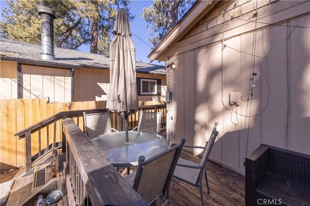 wooden terrace featuring outdoor dining area