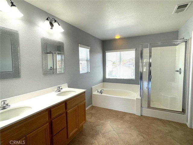 31556 Umbria Ln, Winchester, CA 92596 - bathroom with a garden tub, a stall shower, double vanity, a textured ceiling, and tile patterned floors
