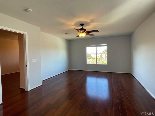 31556 Umbria Ln, Winchester, CA 92596 - unfurnished room with a smoke detector, dark wood-style floors, and a ceiling fan