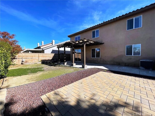 31556 Umbria Ln, Winchester, CA 92596 - back of property featuring a pergola, a fenced backyard, a patio area, and stucco siding
