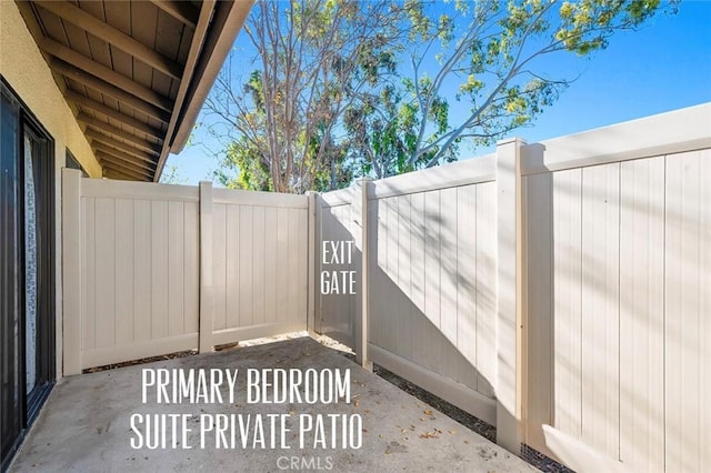 view of patio featuring fence