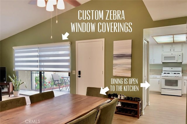 dining room featuring light wood-type flooring, ceiling fan, and high vaulted ceiling