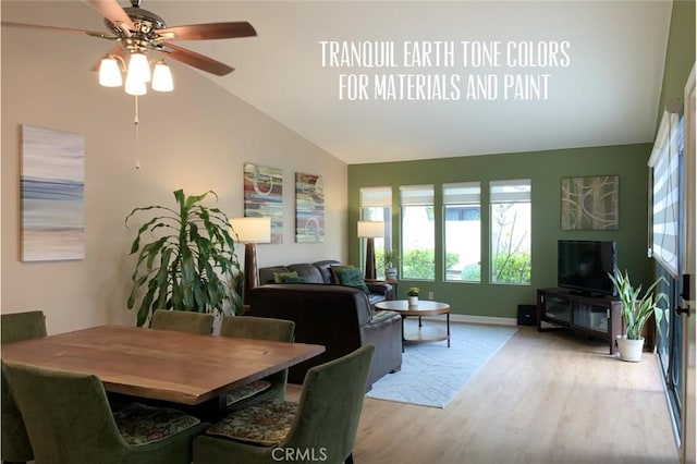 dining area with a ceiling fan, vaulted ceiling, wood finished floors, and a wealth of natural light