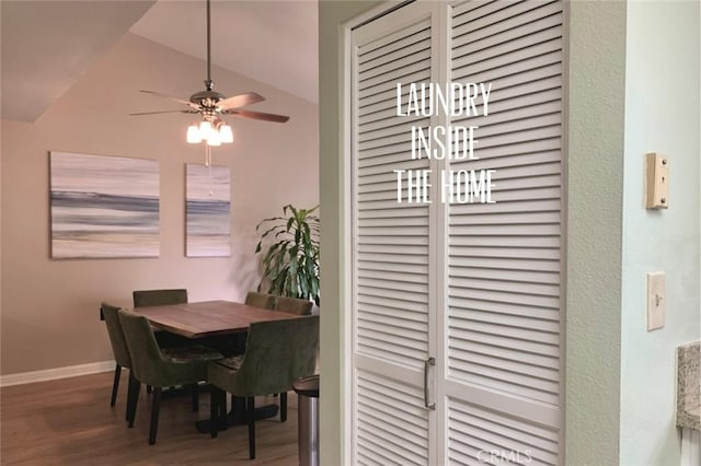 dining space featuring baseboards, ceiling fan, wood finished floors, and lofted ceiling
