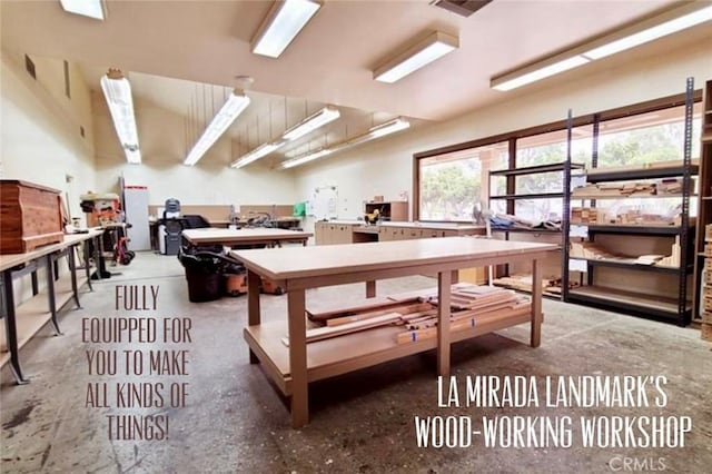 misc room with a workshop area and visible vents