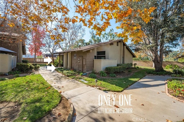 view of side of home featuring fence