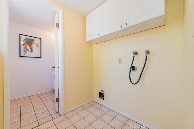 578 Vista Rambla, Walnut, CA 91789 - laundry room with cabinet space, hookup for a washing machine, baseboards, hookup for an electric dryer, and light tile patterned flooring