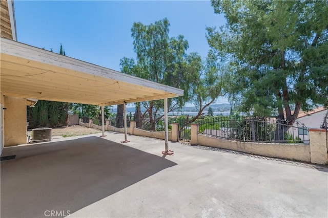 578 Vista Rambla, Walnut, CA 91789 - view of patio featuring concrete driveway, fence, central AC, and a carport