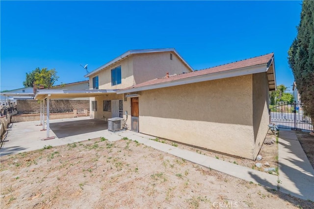578 Vista Rambla, Walnut, CA 91789 - back of house featuring stucco siding, fence, a patio area, and central air condition unit