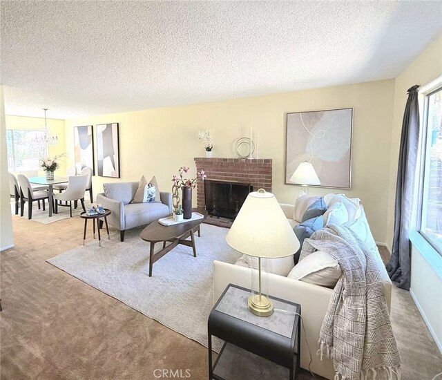 578 Vista Rambla, Walnut, CA 91789 - carpeted living room featuring healthy amount of natural light, a textured ceiling, a fireplace, and baseboards
