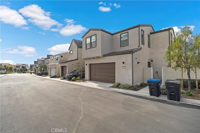 view of road featuring curbs, sidewalks, and a residential view
