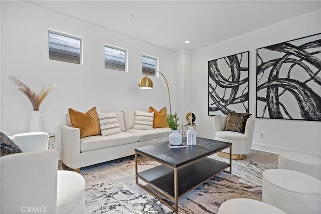 living room with baseboards and wood finished floors
