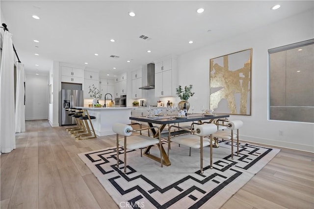 dining room featuring recessed lighting, visible vents, and light wood-style floors