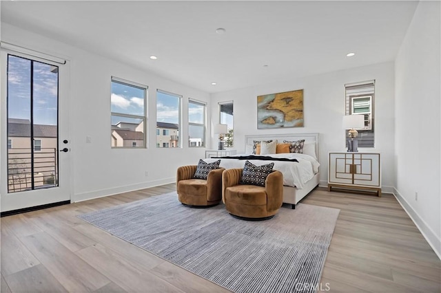bedroom with recessed lighting, baseboards, access to outside, and light wood finished floors