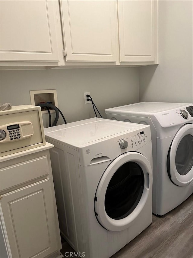 8577 San Romolo Way, Buena Park, CA 90620 - clothes washing area with washer and clothes dryer, cabinet space, and wood finished floors