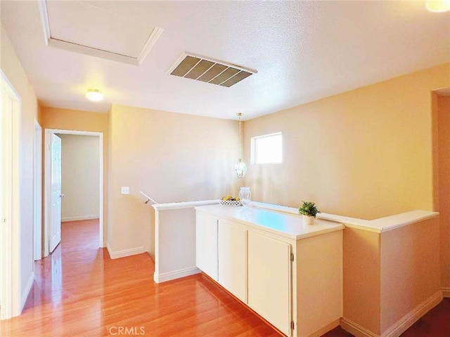 14627 Palm St, Adelanto, CA 92301 - hall with an upstairs landing and light wood-style floors
