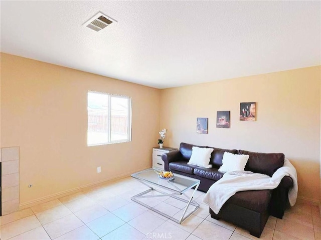 14627 Palm St, Adelanto, CA 92301 - living area with light tile patterned floors and a textured ceiling