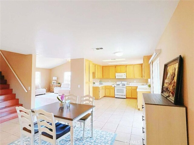 14627 Palm St, Adelanto, CA 92301 - dining area with light tile patterned floors and stairway