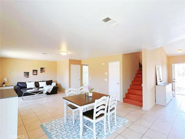14627 Palm St, Adelanto, CA 92301 - dining room with light tile patterned flooring and stairs