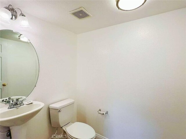 14627 Palm St, Adelanto, CA 92301 - bathroom with toilet and a sink