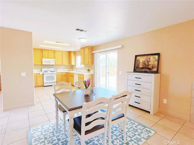 14627 Palm St, Adelanto, CA 92301 - dining area with light tile patterned floors and baseboards