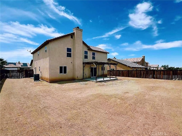 14627 Palm St, Adelanto, CA 92301 - back of property featuring a pergola, stucco siding, a patio area, a fenced backyard, and a chimney