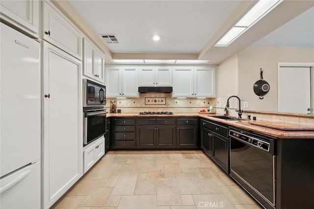33046 Ocean Rdg, Dana Point, CA 92629 - kitchen featuring a sink, white cabinets, under cabinet range hood, and black appliances