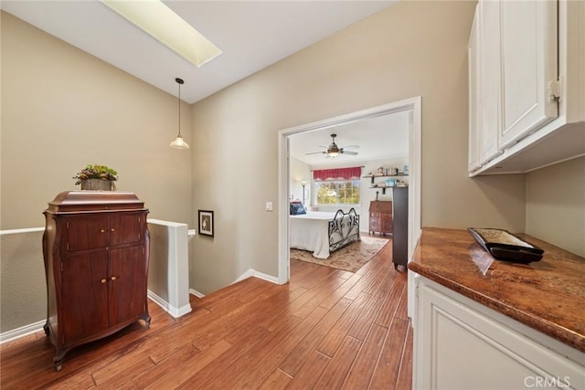 33046 Ocean Rdg, Dana Point, CA 92629 - corridor featuring light wood-style flooring, vaulted ceiling, and an upstairs landing